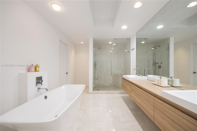 bathroom featuring separate shower and tub and vanity