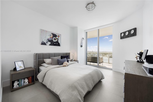 bedroom with access to outside and floor to ceiling windows