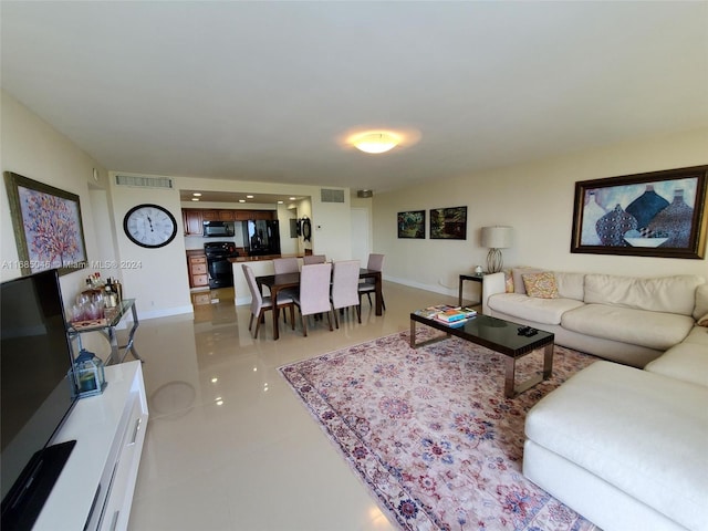 living room with tile patterned floors