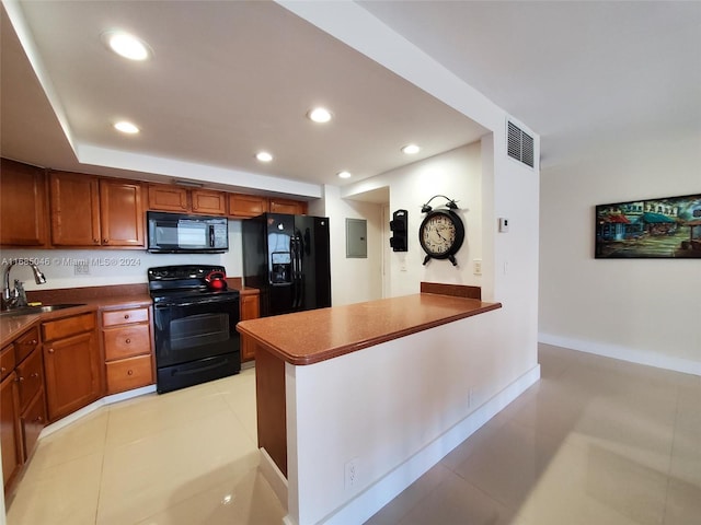 kitchen with electric panel, black appliances, sink, and light tile patterned floors