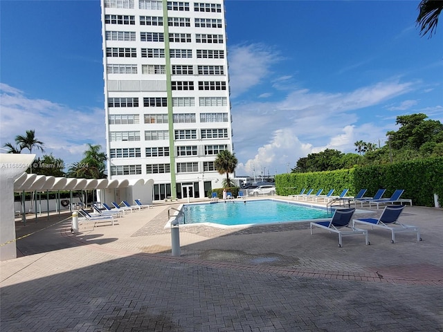 view of swimming pool featuring a patio area