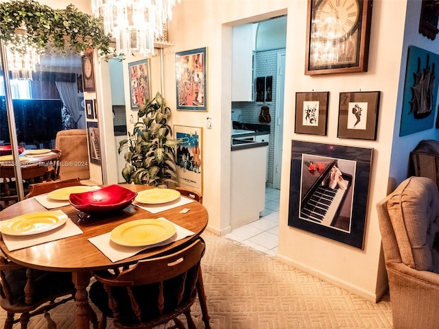 tiled dining area with a notable chandelier