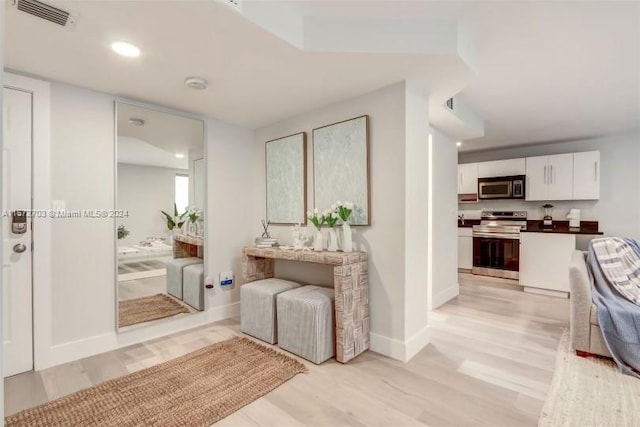 hall featuring light hardwood / wood-style floors