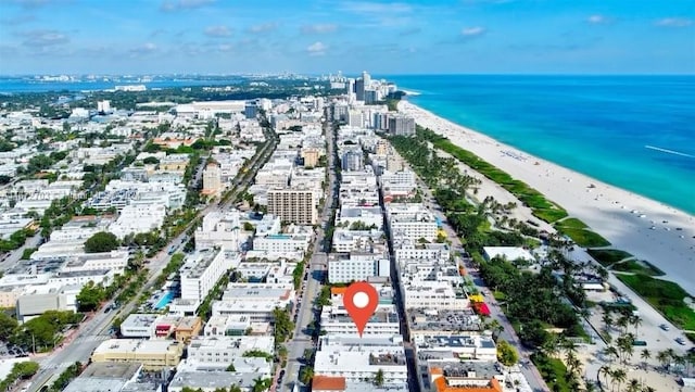 aerial view featuring a view of the beach and a water view