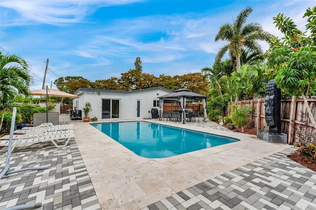 view of pool with a gazebo and a patio area