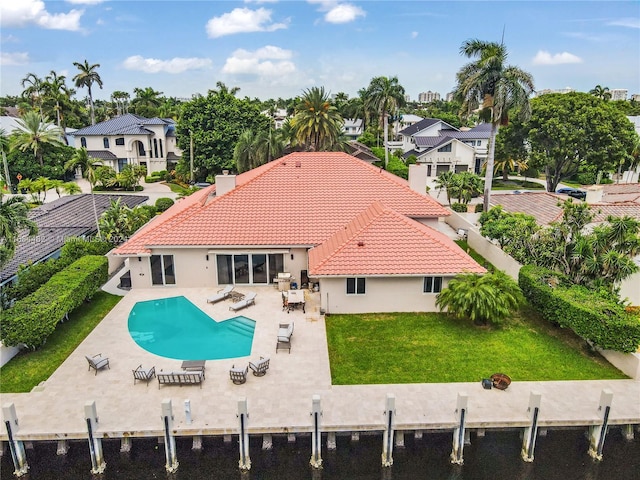 34 Pelican Dr, Fort Lauderdale, FL 33301 - rear view of property featuring a tile roof, stucco siding, and a patio