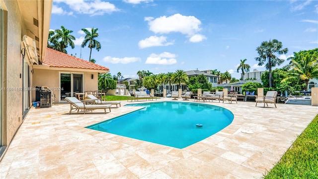 view of swimming pool with a patio area