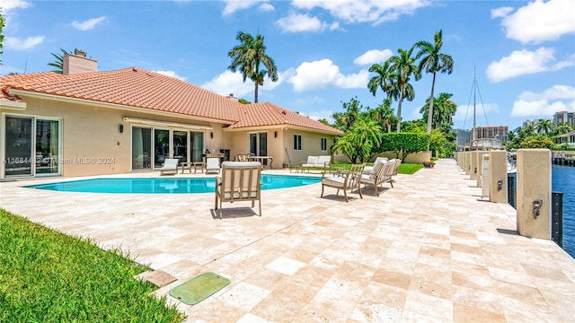 view of swimming pool with a patio area