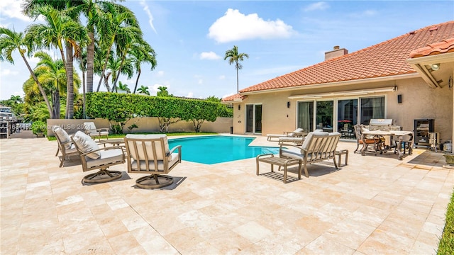 view of pool featuring a patio