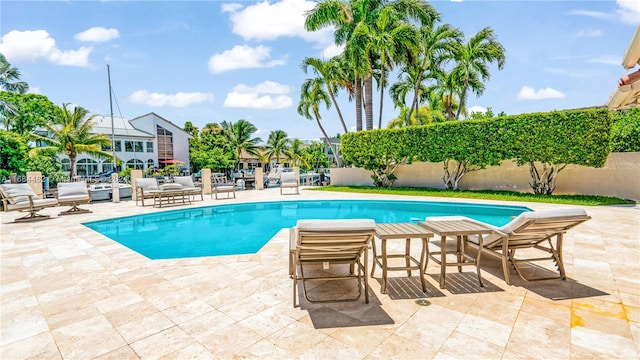 view of pool with a patio area and an outdoor living space