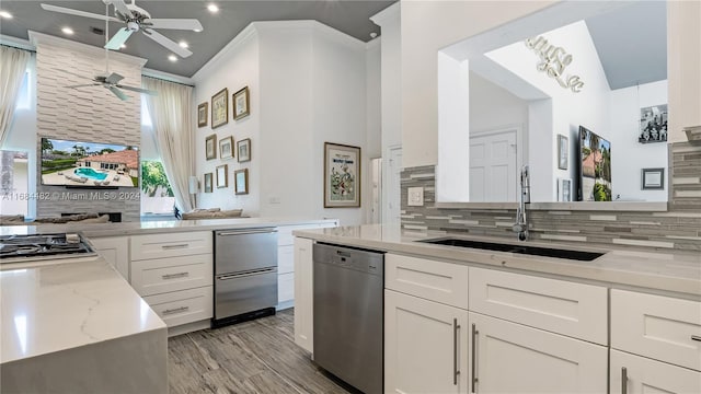 34 Pelican Dr, Fort Lauderdale, FL 33301 - kitchen featuring dishwasher, a sink, a ceiling fan, tasteful backsplash, and recessed lighting