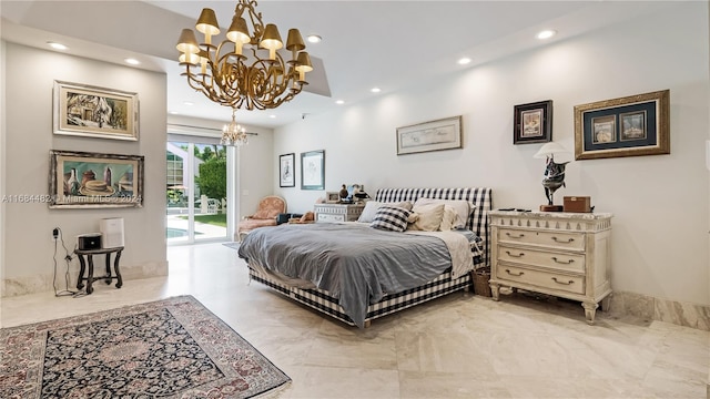 bedroom with access to exterior and a chandelier