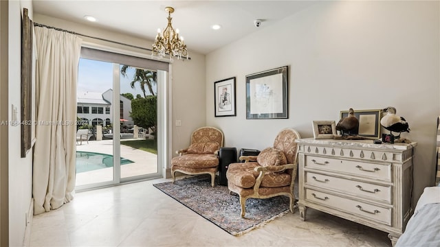 living area featuring an inviting chandelier