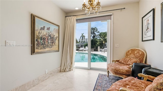 living area featuring a notable chandelier