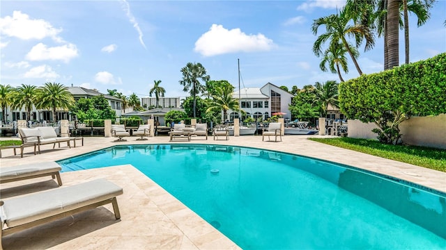 view of swimming pool featuring a patio area