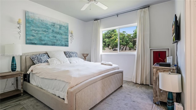 bedroom with hardwood / wood-style floors and ceiling fan