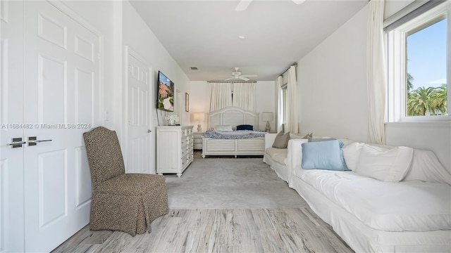 bedroom featuring light hardwood / wood-style flooring and ceiling fan