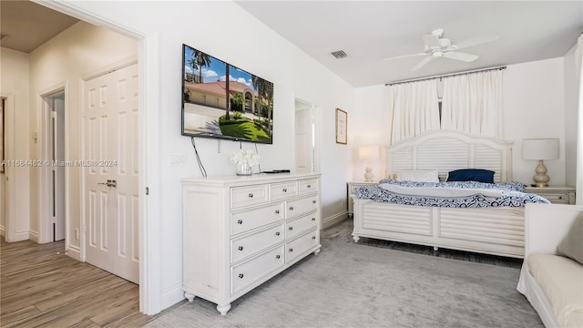 bedroom with light wood-type flooring and ceiling fan