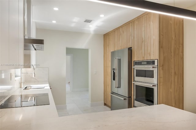 kitchen with recessed lighting, visible vents, baseboards, appliances with stainless steel finishes, and modern cabinets