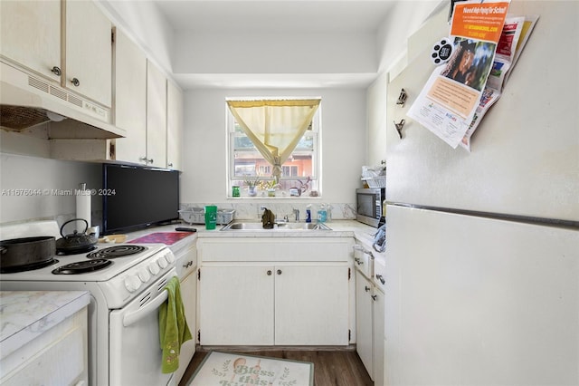 kitchen featuring dark hardwood / wood-style floors, white cabinetry, white appliances, and sink