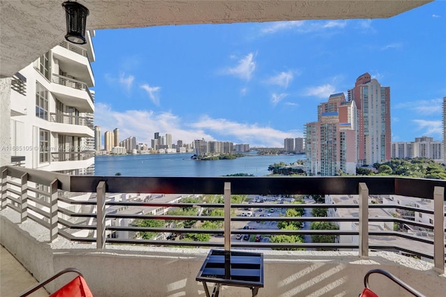 balcony featuring a water view