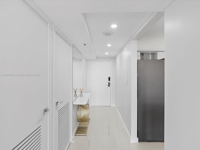 hallway with light wood-type flooring