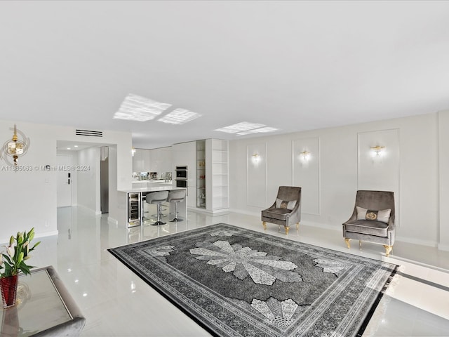 living room with light tile patterned floors and beverage cooler