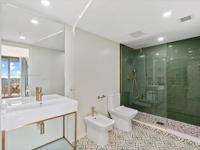 bathroom featuring a tile shower, toilet, and a bidet