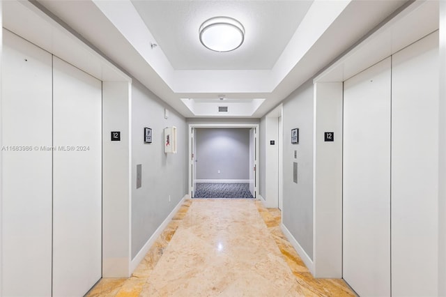 corridor featuring elevator