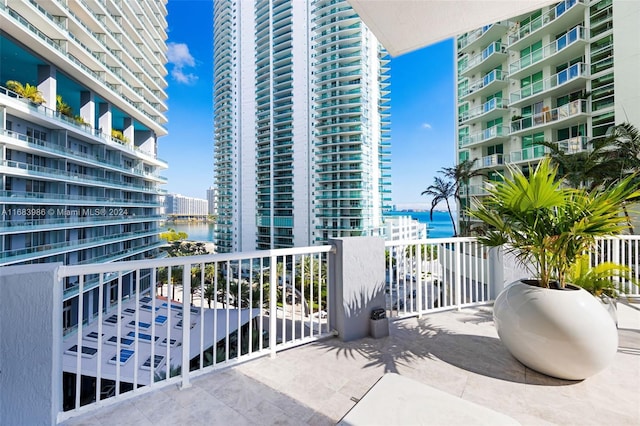 balcony featuring a water view