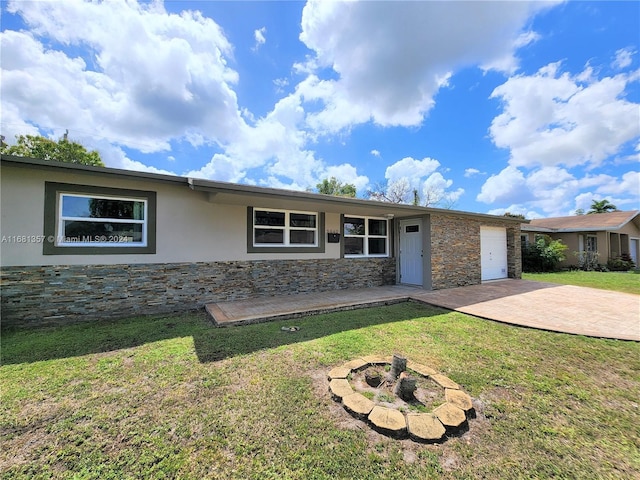 single story home featuring a patio and a front yard