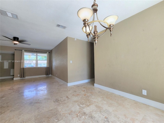 unfurnished room with a textured ceiling and ceiling fan with notable chandelier