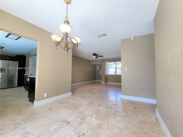 unfurnished room featuring a textured ceiling and ceiling fan with notable chandelier