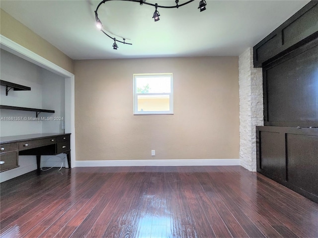 unfurnished office featuring dark hardwood / wood-style flooring