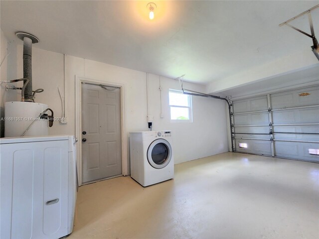 clothes washing area with gas water heater and washer and clothes dryer