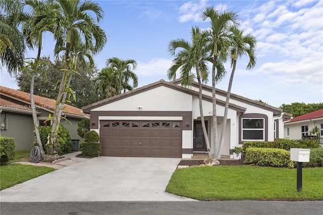 view of front of house featuring a front yard and a garage