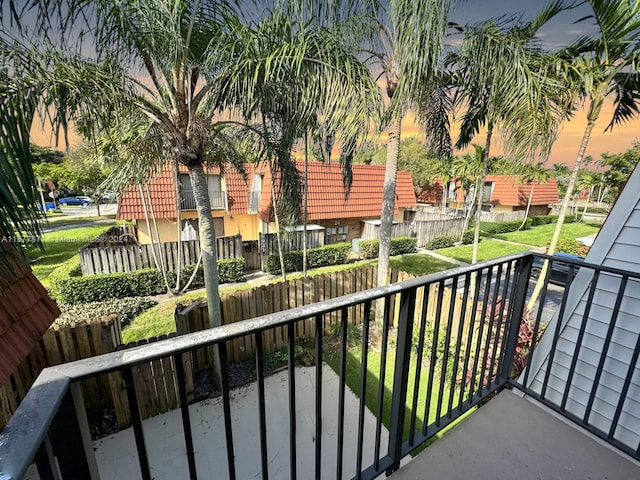 view of balcony at dusk