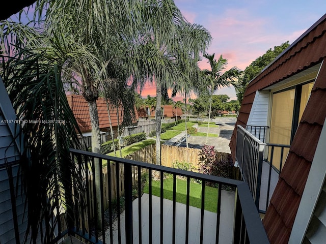 view of balcony at dusk