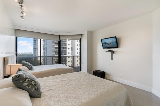 3600 Yacht Club Dr Unit 803, Aventura, FL 33180 - bedroom with baseboards and track lighting