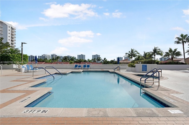 view of swimming pool featuring a patio