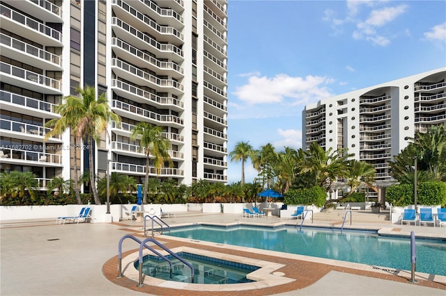 view of pool with a community hot tub