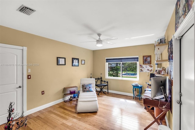 sitting room featuring ceiling fan and light hardwood / wood-style flooring