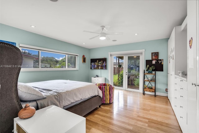 bedroom featuring light hardwood / wood-style flooring, access to outside, and ceiling fan