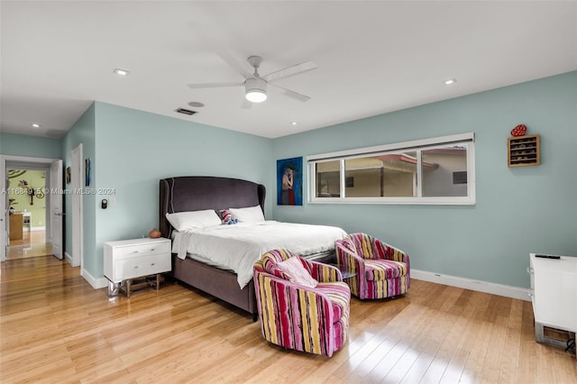 bedroom featuring ceiling fan and light hardwood / wood-style flooring