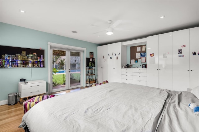 bedroom with light hardwood / wood-style floors, access to outside, and ceiling fan