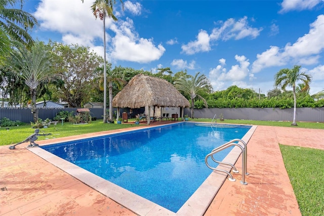 view of swimming pool featuring a yard, a gazebo, and a patio area