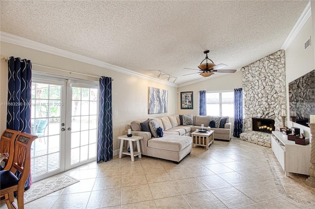 tiled living room featuring vaulted ceiling, a fireplace, crown molding, a textured ceiling, and french doors