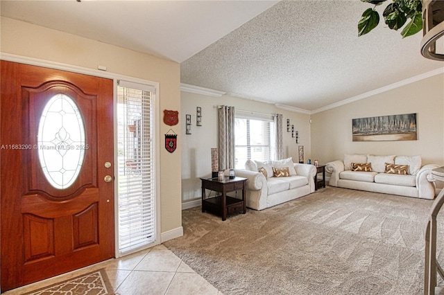 entrance foyer featuring light carpet, ornamental molding, lofted ceiling, and a textured ceiling