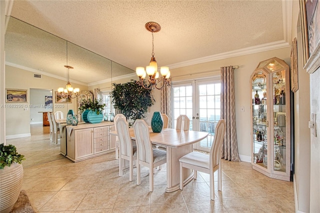 tiled dining room with lofted ceiling, a notable chandelier, ornamental molding, a textured ceiling, and french doors