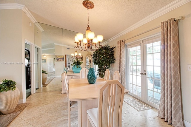 tiled dining area with a notable chandelier, crown molding, french doors, and a textured ceiling